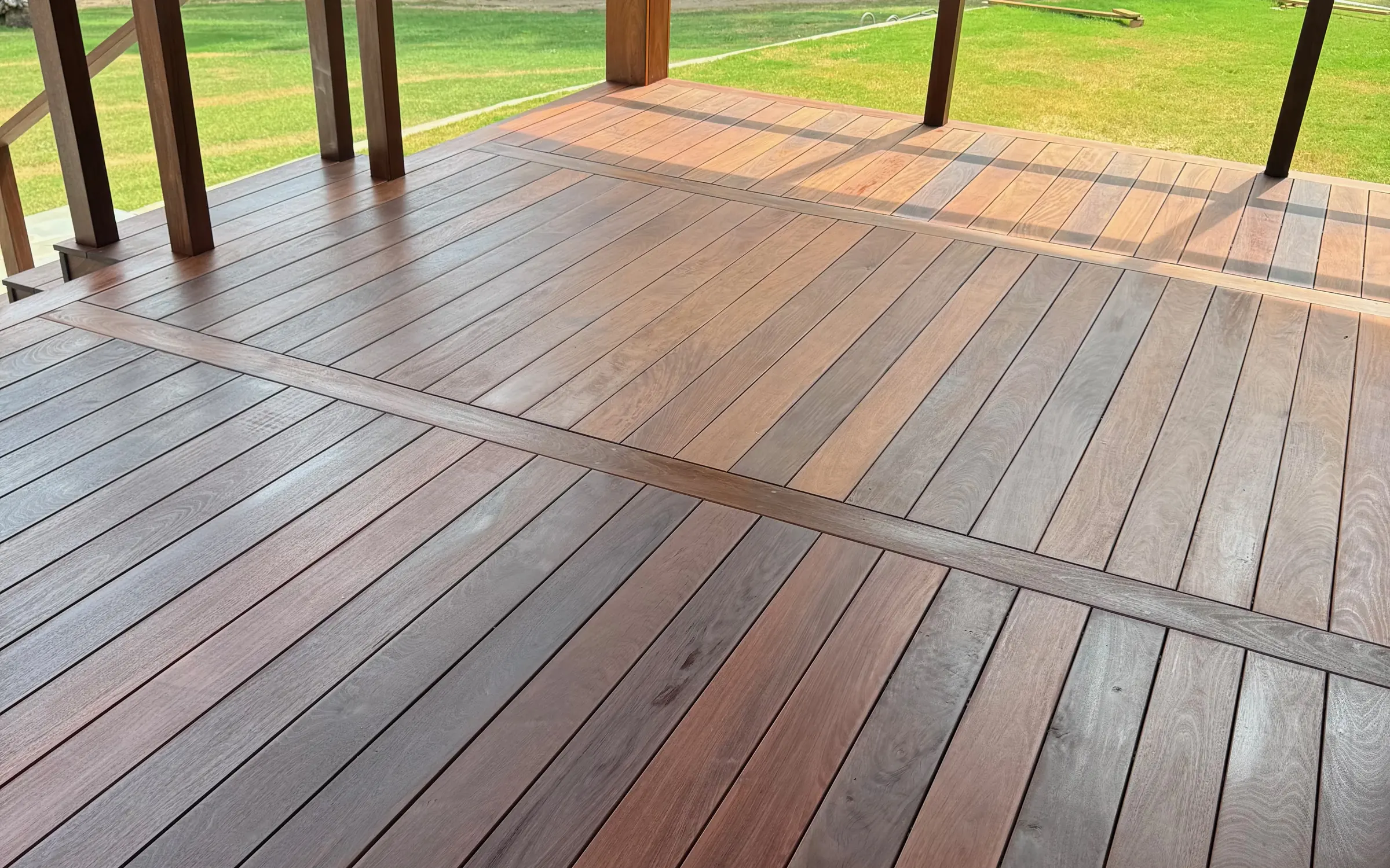 Covered ipe deck overlooking an open lawn