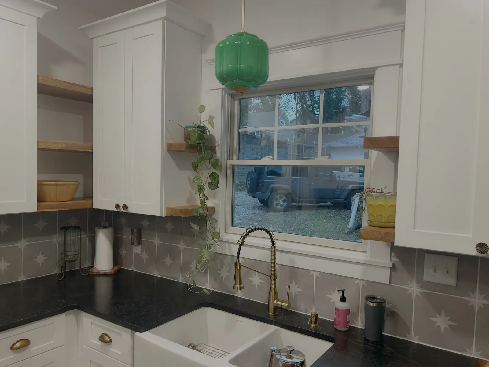Kitchen backsplash with hardwood shelves and custom cabinets