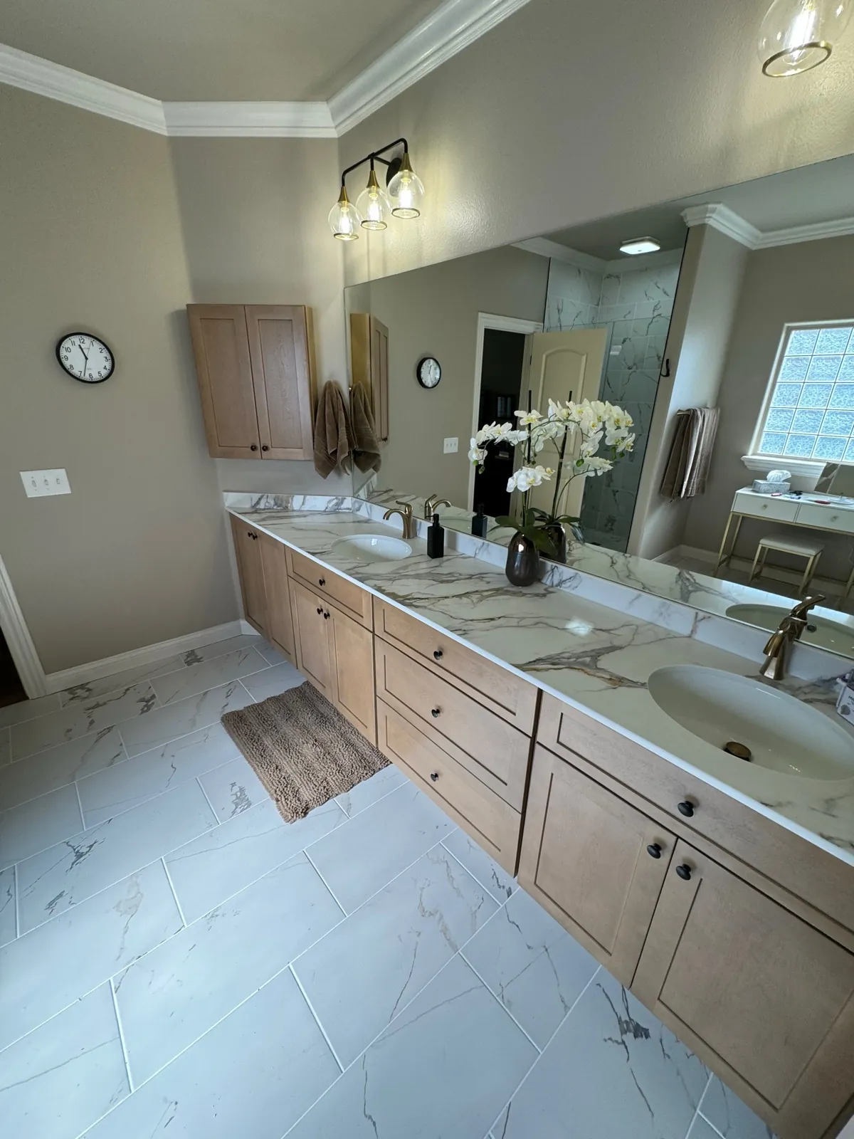 Wood vanity with quartz counter and double sinks