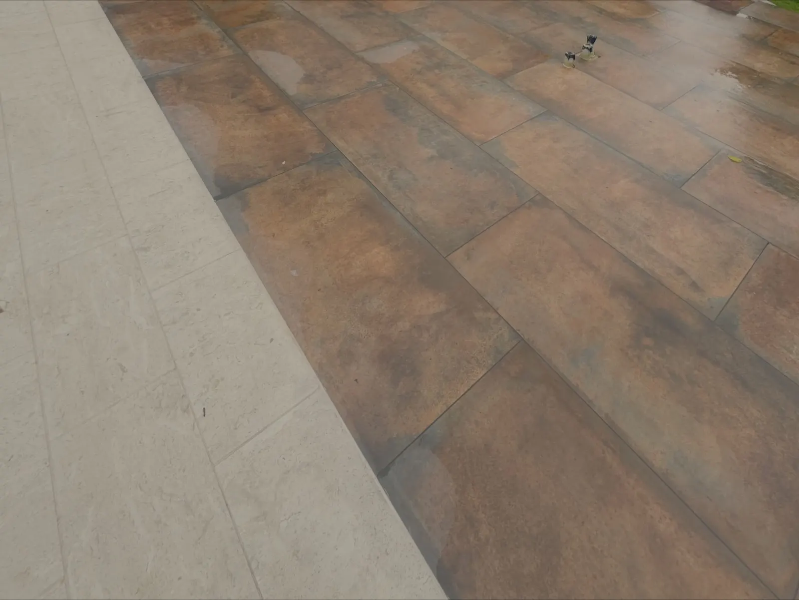 Porcelain tile pool patio with stone work