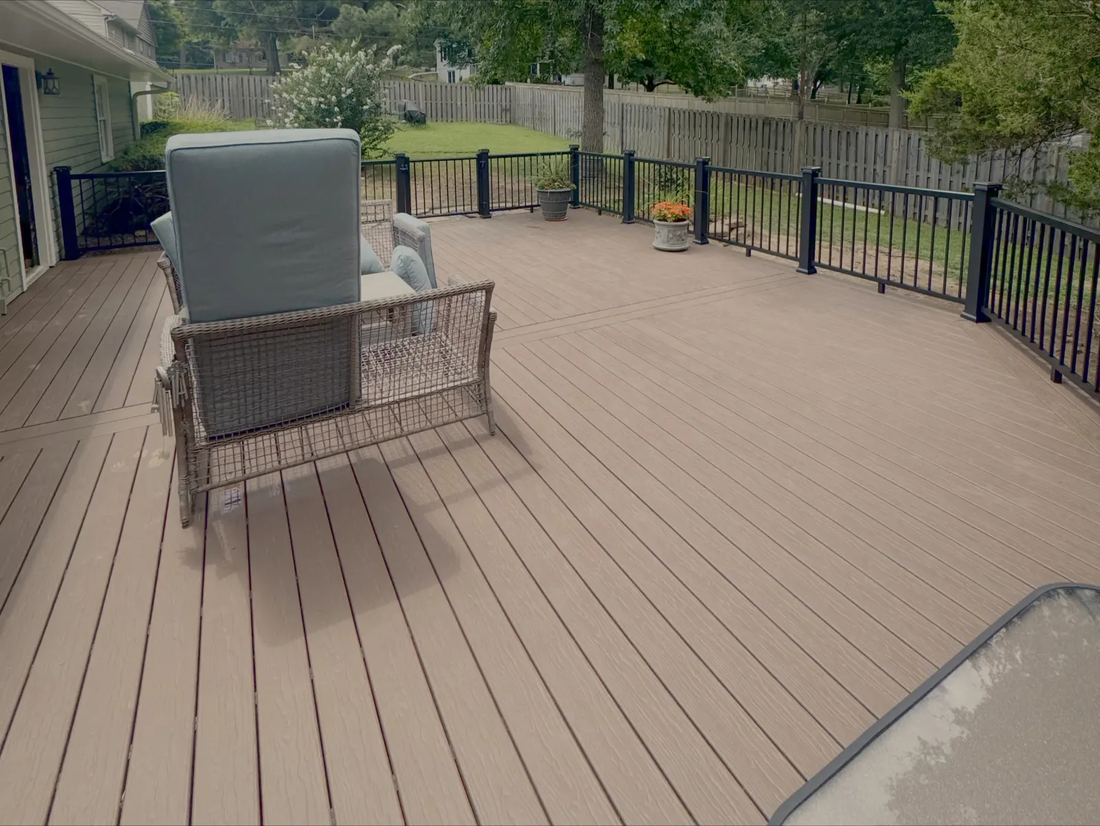 Waterproof composite deck with metal railing