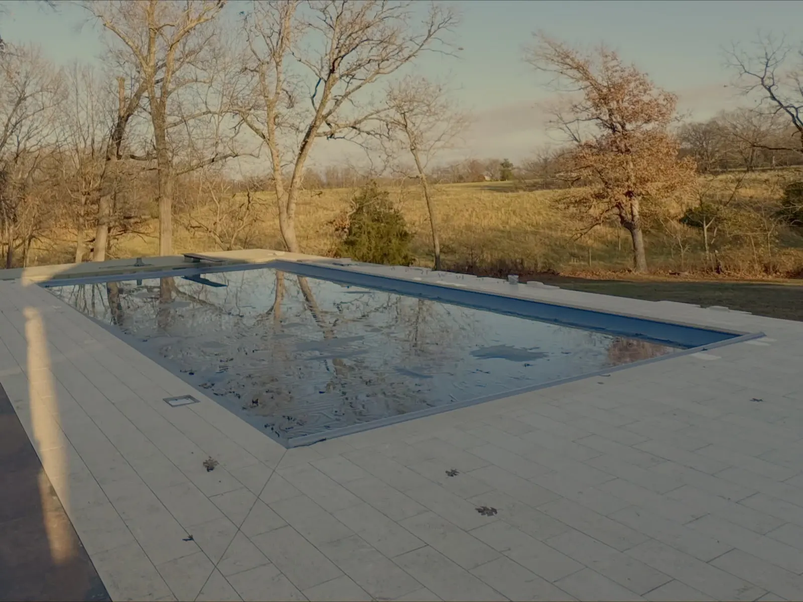 Paver pool deck with exterior stone tile