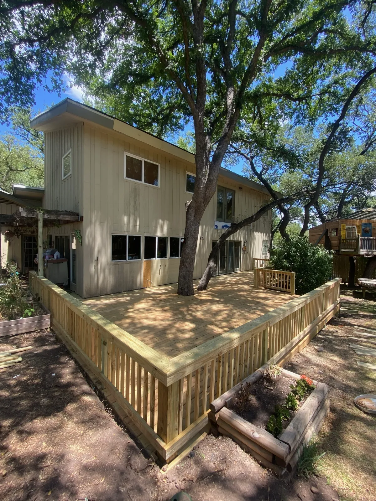 Wood deck under mature oak trees