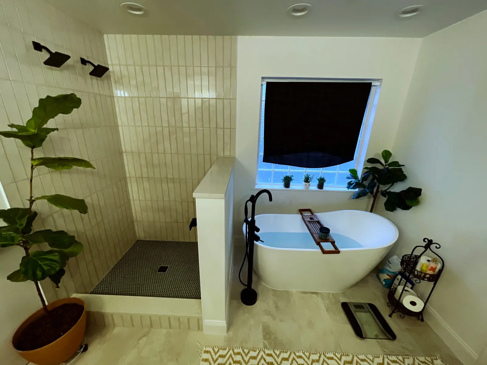 Bathroom remodel with freestanding tub and floor tile