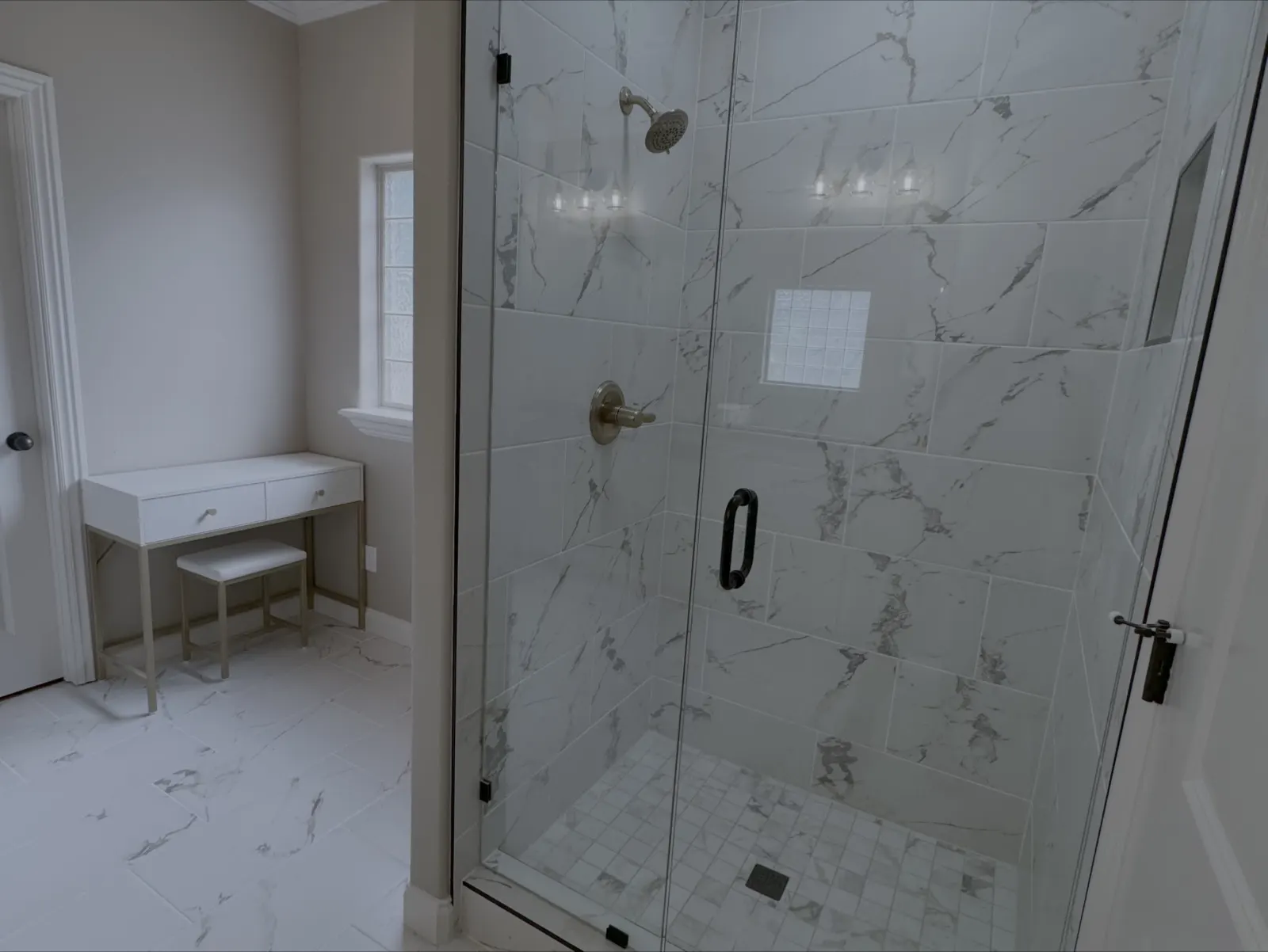 Custom shower with marble look tile