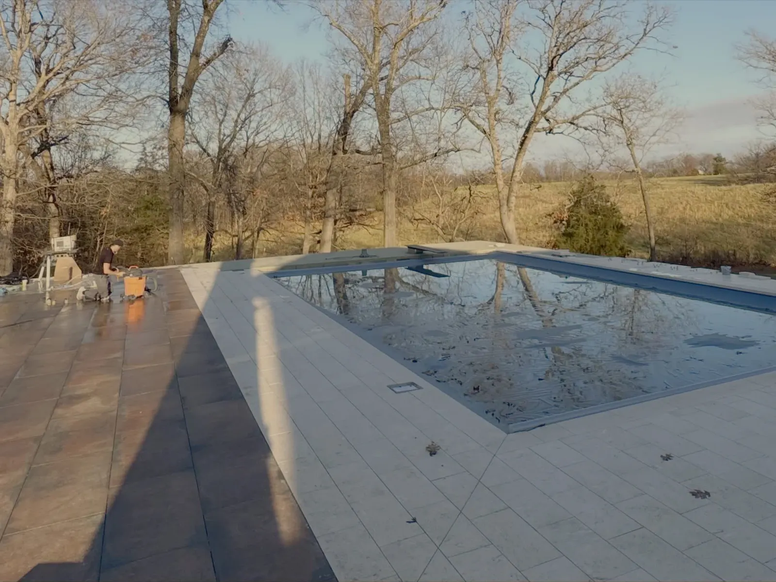 Porcelain paver pool deck with exterior stone